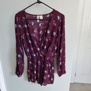 Plum colored floral boho long sleeve romper